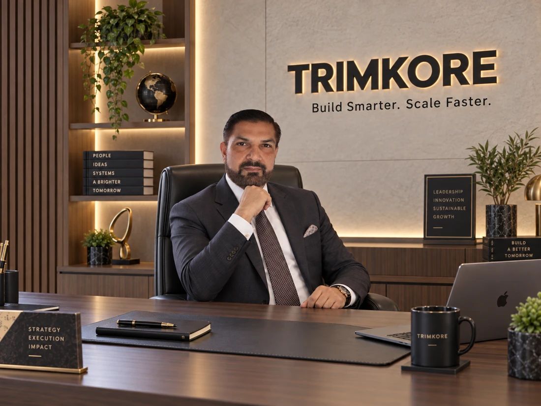 The founder of TrimKore seated at his office desk.